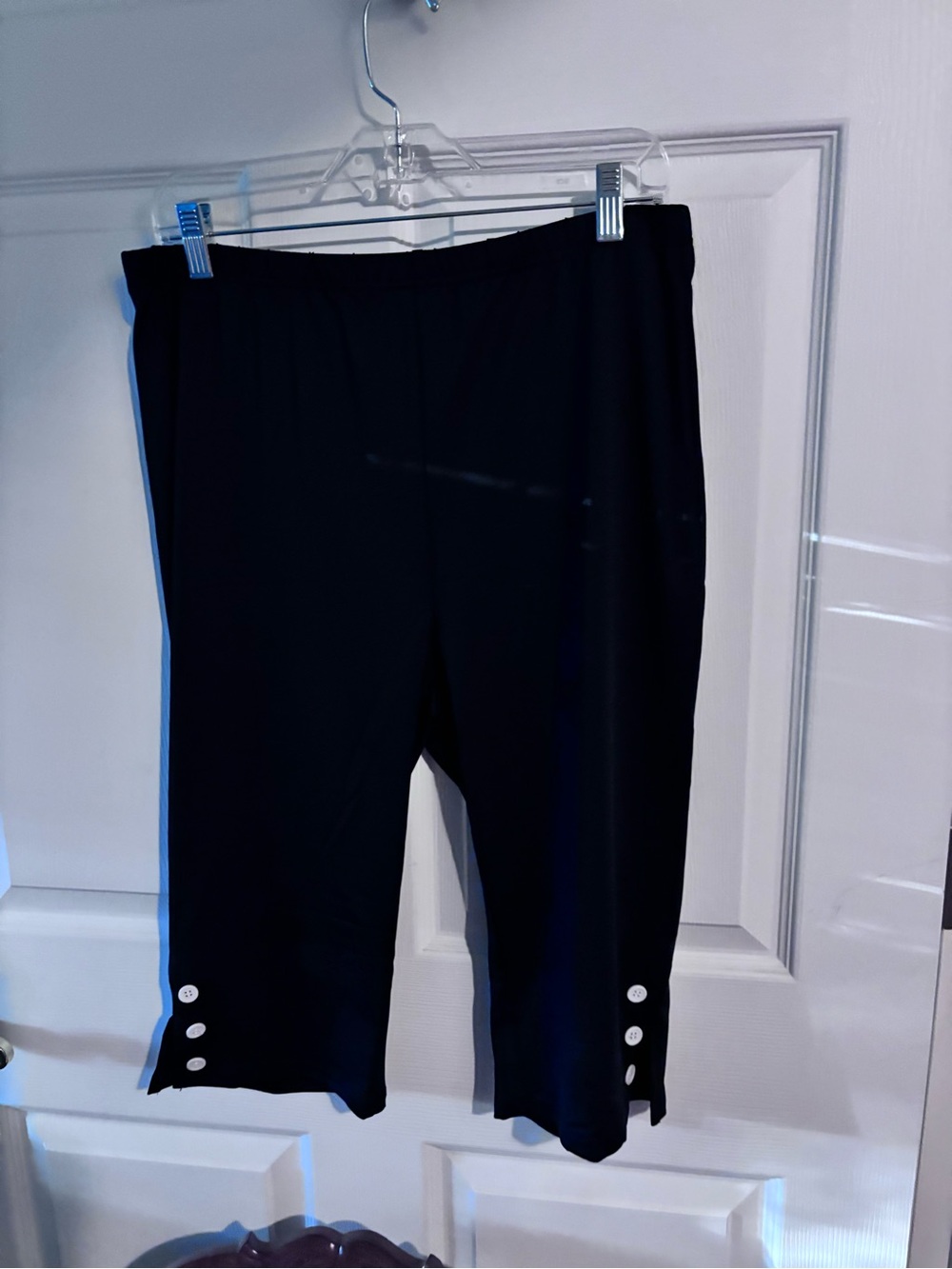 Black capris with whir buttons
